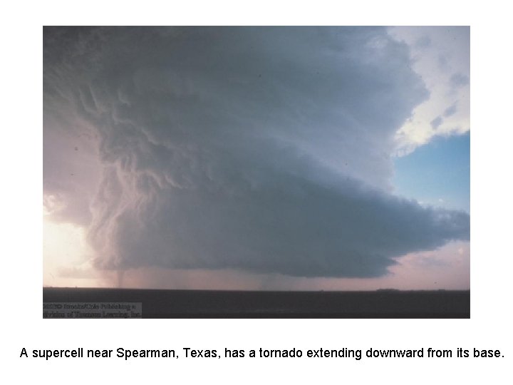 A supercell near Spearman, Texas, has a tornado extending downward from its base. 