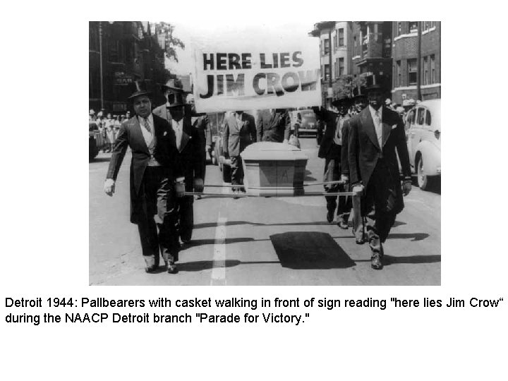 Detroit 1944: Pallbearers with casket walking in front of sign reading "here lies Jim