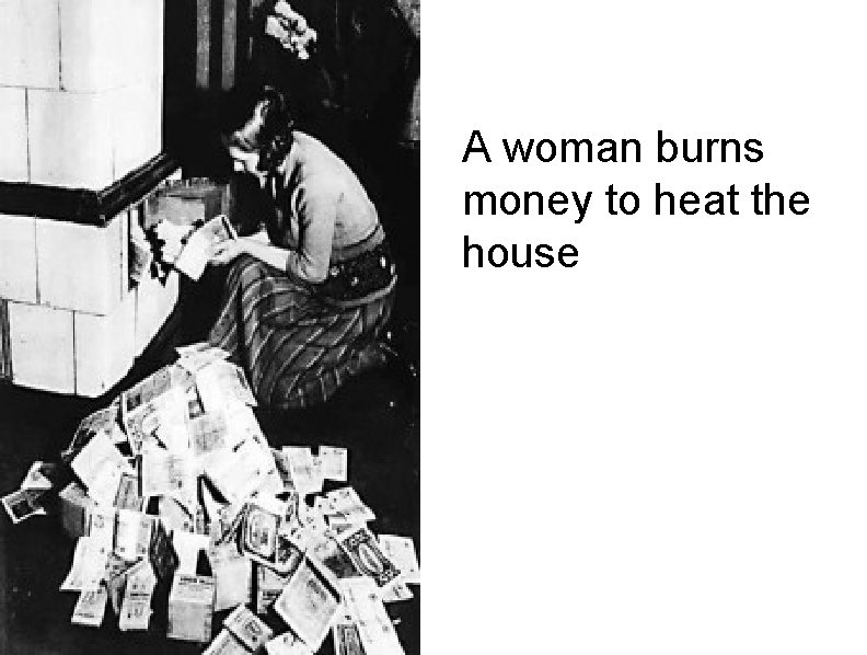 A woman burns money to heat the house 