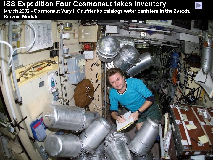 ISS Expedition Four Cosmonaut takes Inventory March 2002 - Cosmonaut Yury I. Onufrienko catalogs