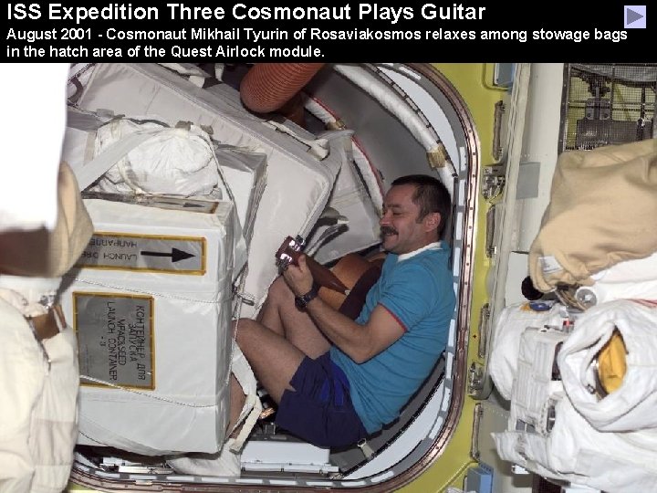 ISS Expedition Three Cosmonaut Plays Guitar August 2001 - Cosmonaut Mikhail Tyurin of Rosaviakosmos