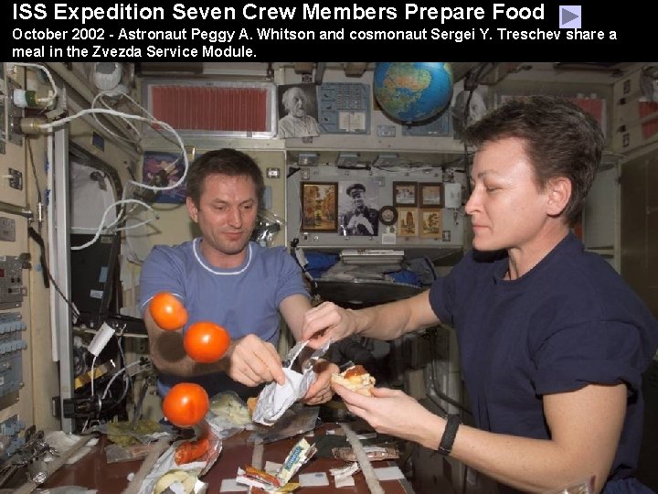 ISS Expedition Seven Crew Members Prepare Food October 2002 - Astronaut Peggy A. Whitson