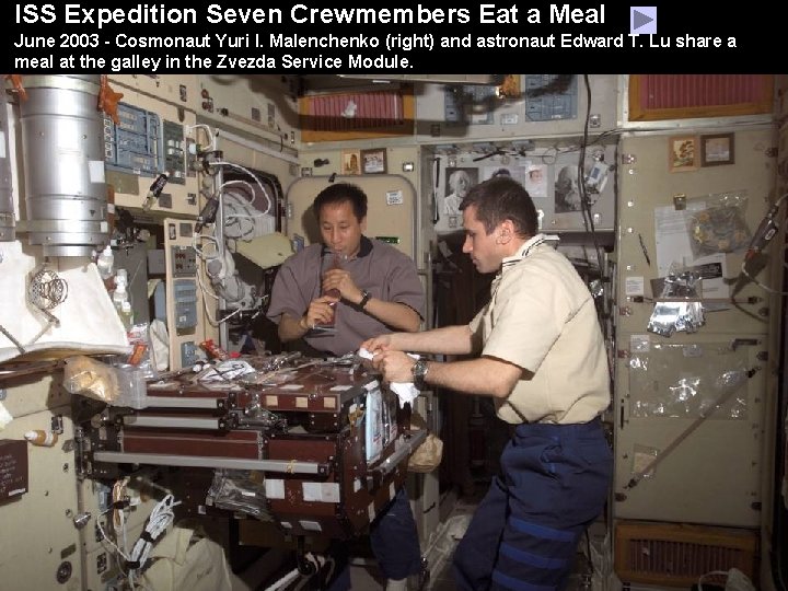 ISS Expedition Seven Crewmembers Eat a Meal June 2003 - Cosmonaut Yuri I. Malenchenko