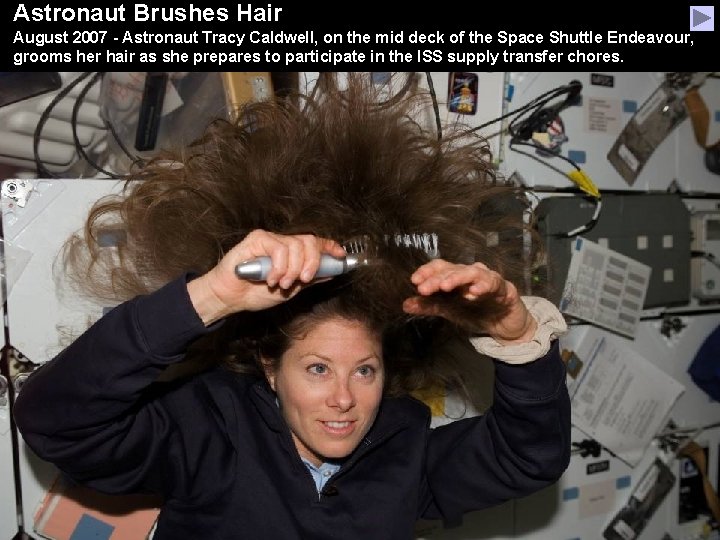 Astronaut Brushes Hair August 2007 - Astronaut Tracy Caldwell, on the mid deck of