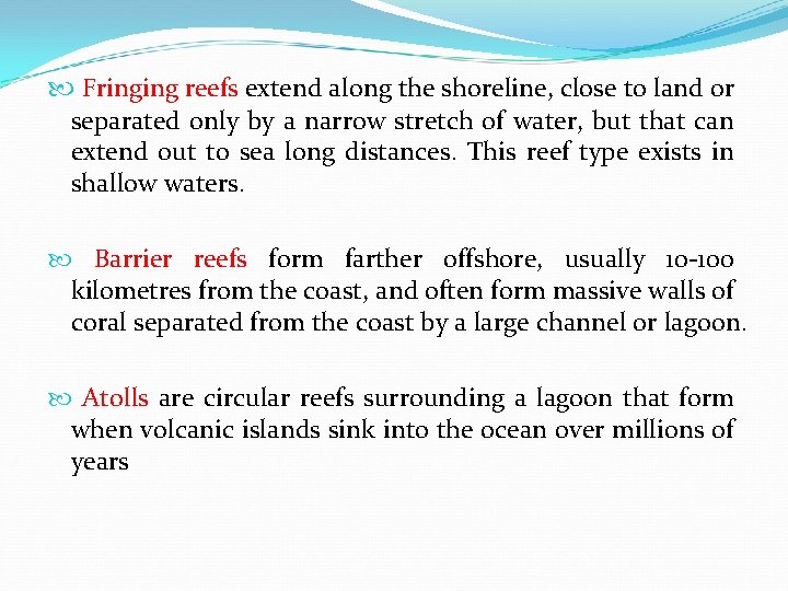  Fringing reefs extend along the shoreline, close to land or separated only by