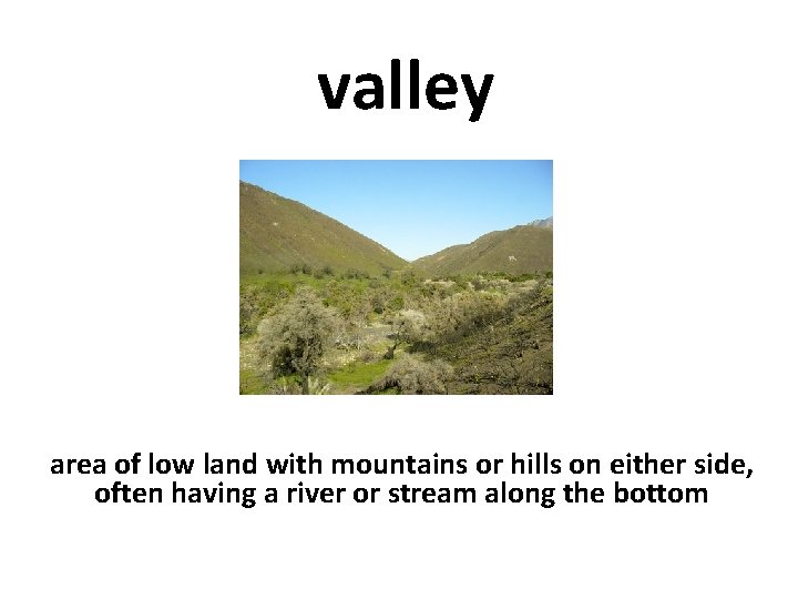 valley area of low land with mountains or hills on either side, often having