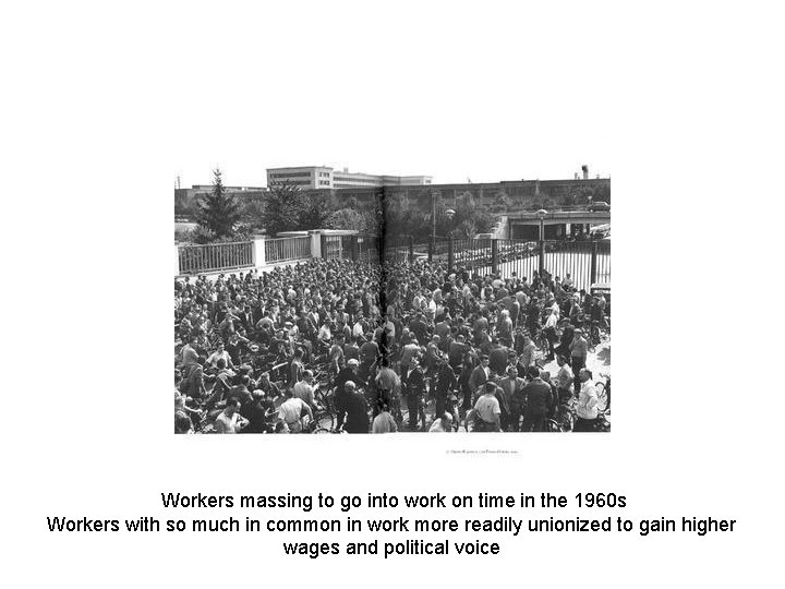 Workers massing to go into work on time in the 1960 s Workers with