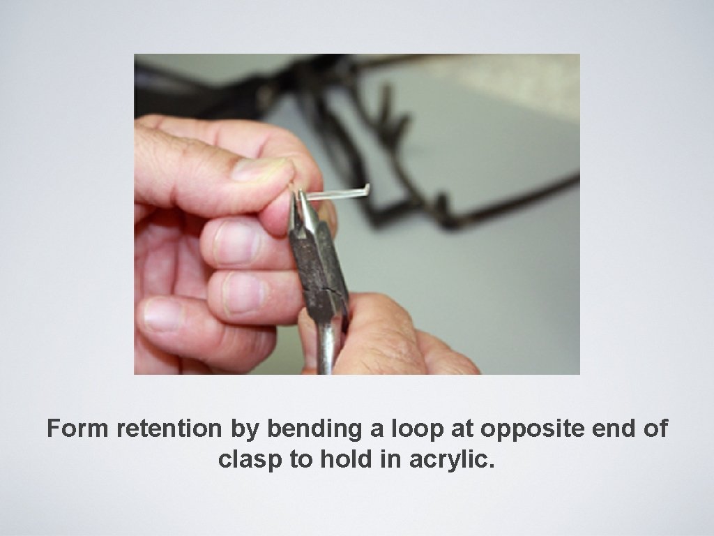 Form retention by bending a loop at opposite end of clasp to hold in