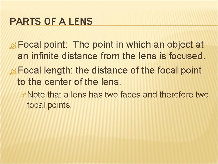PARTS OF A LENS Focal point: The point in which an object at an PARTS OF A LENS Focal point: The point in which an object at an