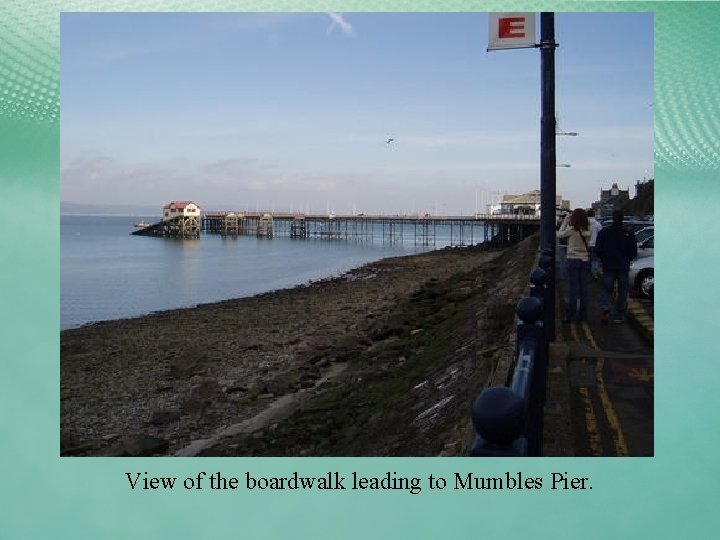 View of the boardwalk leading to Mumbles Pier. 