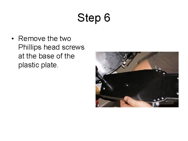 Step 6 • Remove the two Phillips head screws at the base of the