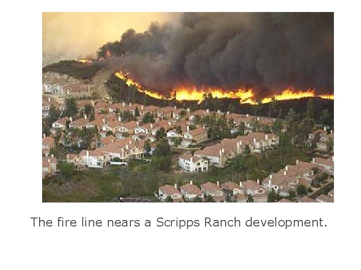 The fire line nears a Scripps Ranch development. 