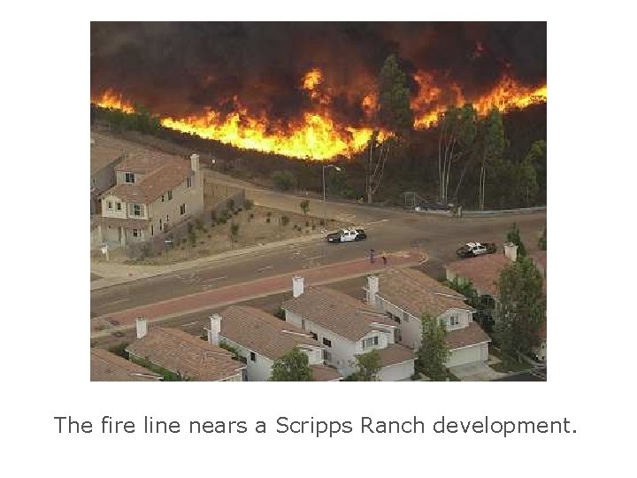 The fire line nears a Scripps Ranch development. 