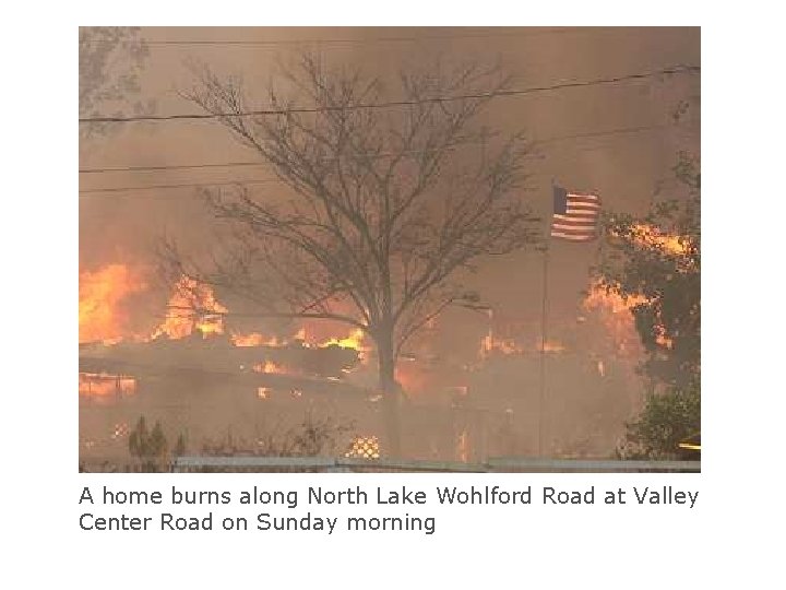 A home burns along North Lake Wohlford Road at Valley Center Road on Sunday