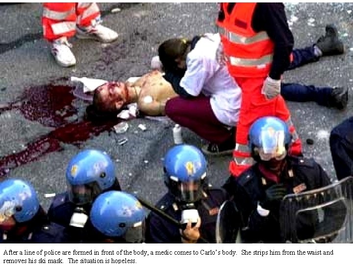 After a line of police are formed in front of the body, a medic