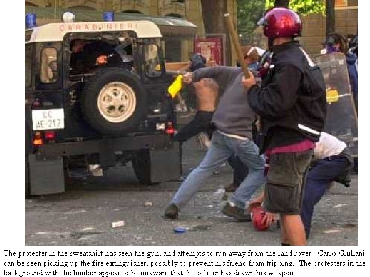 The protester in the sweatshirt has seen the gun, and attempts to run away