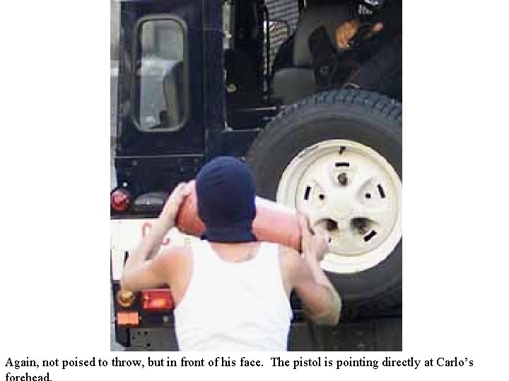 Again, not poised to throw, but in front of his face. The pistol is