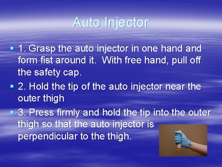 Auto Injector § 1. Grasp the auto injector in one hand form fist around Auto Injector § 1. Grasp the auto injector in one hand form fist around