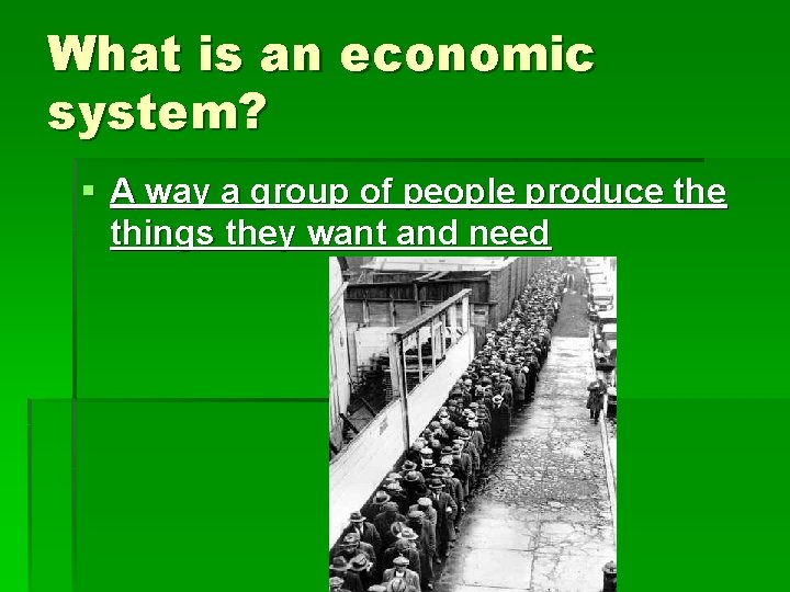 What is an economic system? § A way a group of people produce things