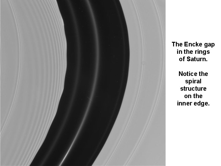 The Encke gap in the rings of Saturn. Notice the spiral structure on the The Encke gap in the rings of Saturn. Notice the spiral structure on the