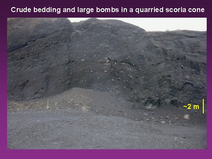 Crude bedding and large bombs in a quarried scoria cone ~2 m 