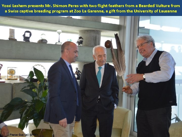 Yossi Leshem presents Mr. Shimon Peres with two flight feathers from a Bearded Vulture