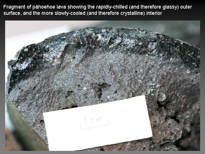 Fragment of pāhoehoe lava showing the rapidly-chilled (and therefore glassy) outer surface, and the