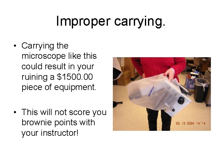 Improper carrying. • Carrying the microscope like this could result in your ruining a