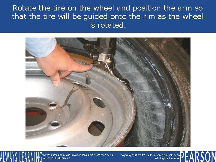 Rotate the tire on the wheel and position the arm so that the tire