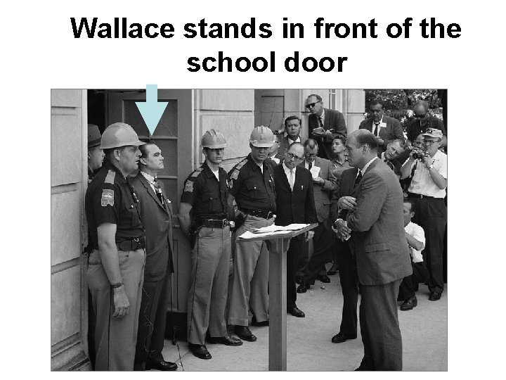 Wallace stands in front of the school door 