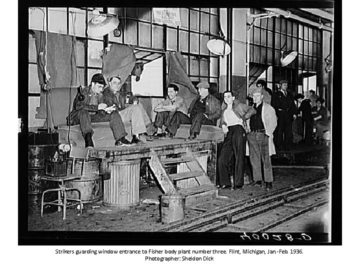 Strikers guarding window entrance to Fisher body plant number three. Flint, Michigan, Jan. -Feb.