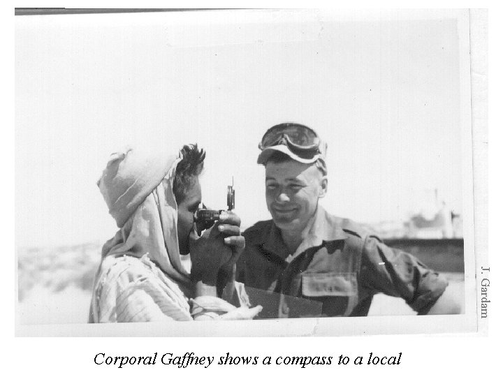 J. Gardam Corporal Gaffney shows a compass to a local 