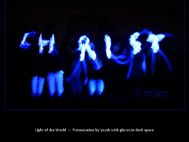 Light of the World -- Presentation by youth with gloves in dark space 