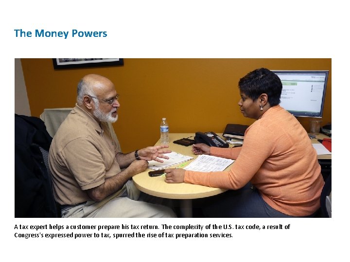 The Money Powers A tax expert helps a customer prepare his tax return. The