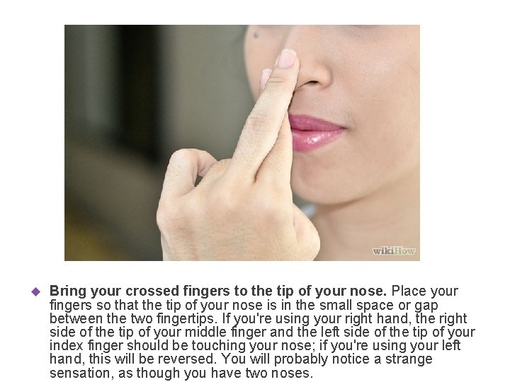  Bring your crossed fingers to the tip of your nose. Place your fingers