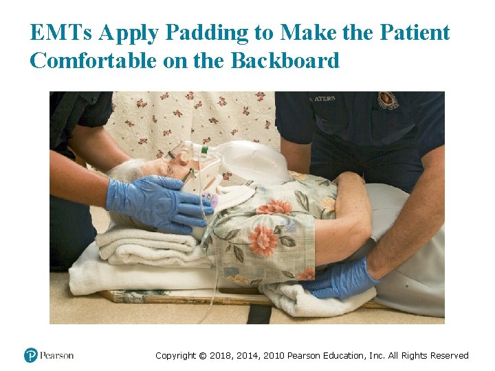 EMTs Apply Padding to Make the Patient Comfortable on the Backboard Copyright © 2018,