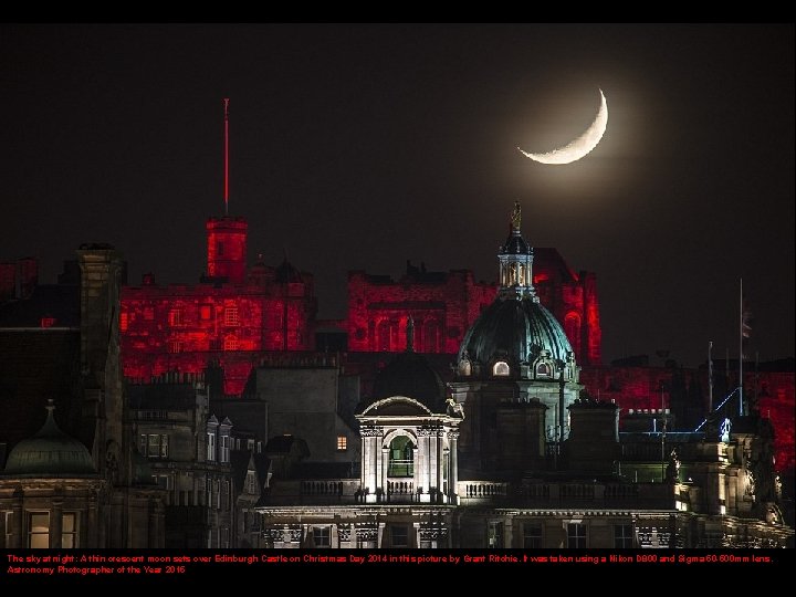 The sky at night: A thin crescent moon sets over Edinburgh Castle on Christmas