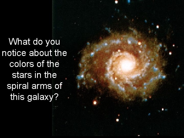 What do you notice about the colors of the stars in the spiral arms