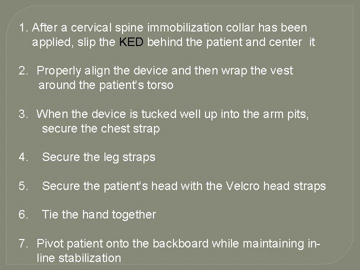 1. After a cervical spine immobilization collar has been applied, slip the KED behind