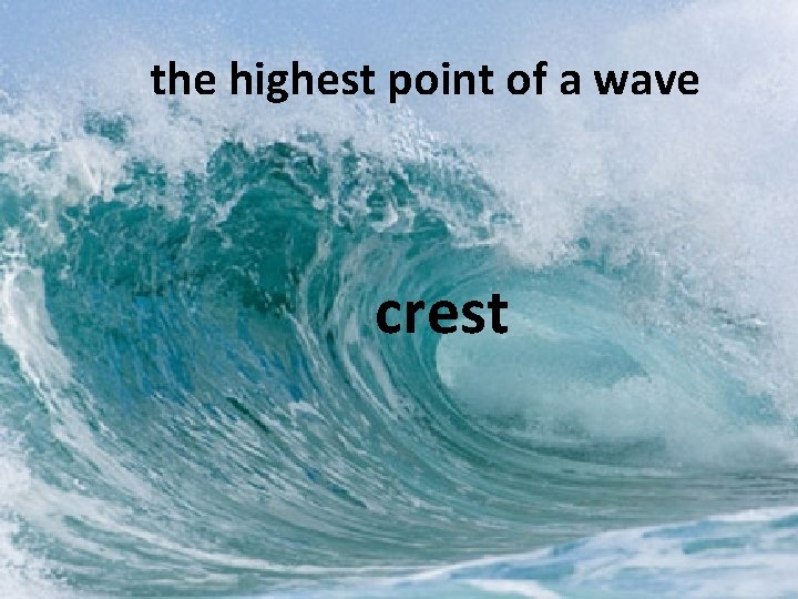the highest point of a wave crest 
