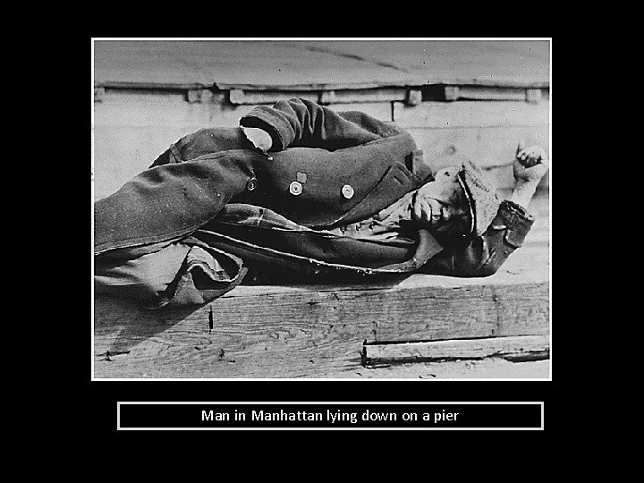 Man in Manhattan lying down on a pier 