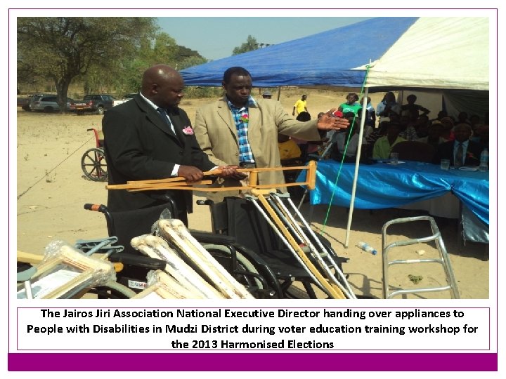 The Jairos Jiri Association National Executive Director handing over appliances to People with Disabilities