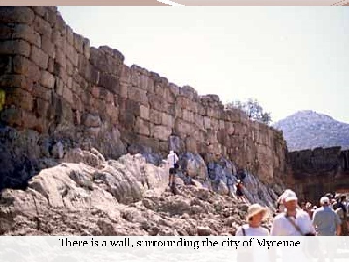 There is a wall, surrounding the city of Mycenae. 