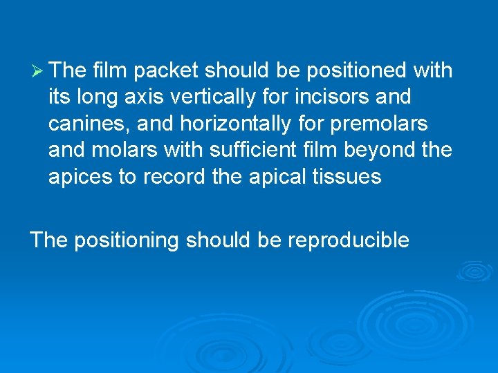 Ø The film packet should be positioned with its long axis vertically for incisors