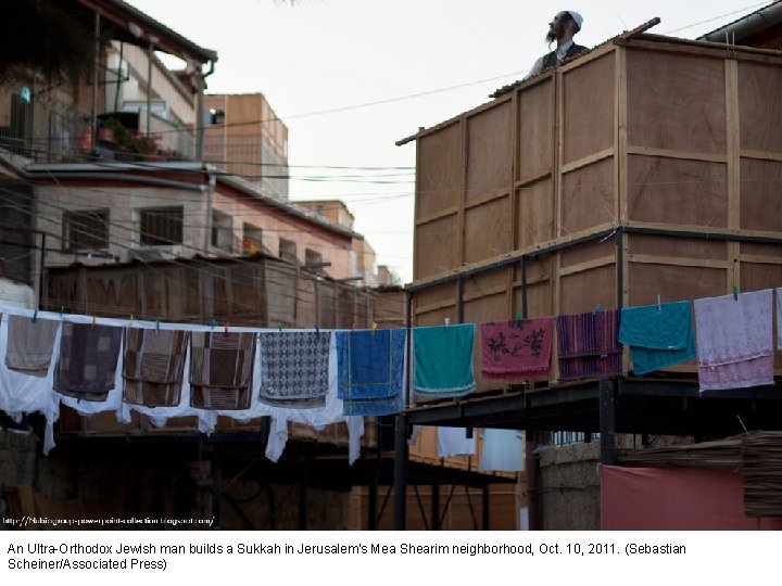 An Ultra-Orthodox Jewish man builds a Sukkah in Jerusalem's Mea Shearim neighborhood, Oct. 10,