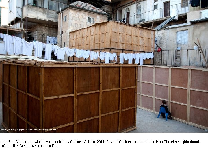 An Ultra-Orthodox Jewish boy sits outside a Sukkah, Oct. 10, 2011. Several Sukkahs are