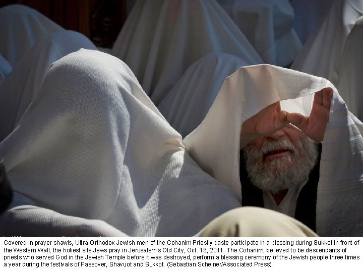 Covered in prayer shawls, Ultra-Orthodox Jewish men of the Cohanim Priestly caste participate in