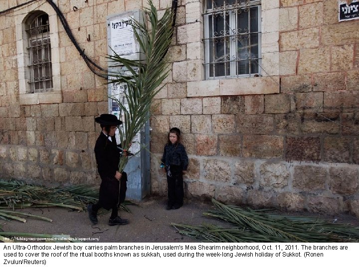 An Ultra-Orthodox Jewish boy carries palm branches in Jerusalem's Mea Shearim neighborhood, Oct. 11,