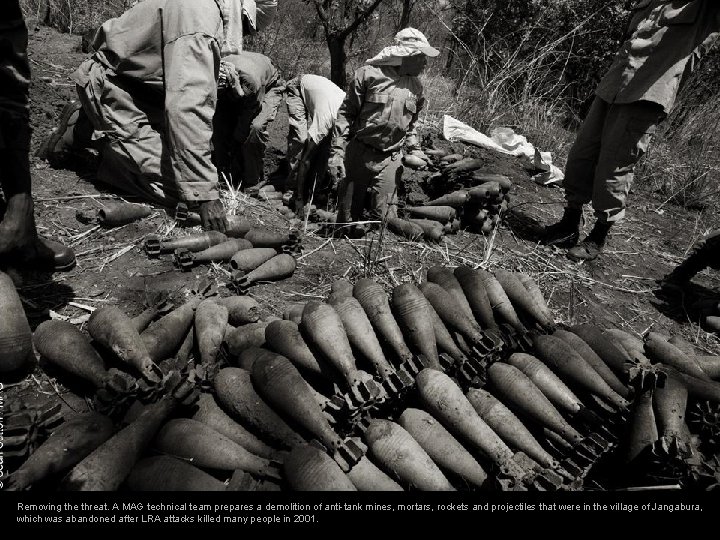 Removing the threat. A MAG technical team prepares a demolition of anti-tank mines, mortars,