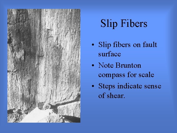 Slip Fibers • Slip fibers on fault surface • Note Brunton compass for scale